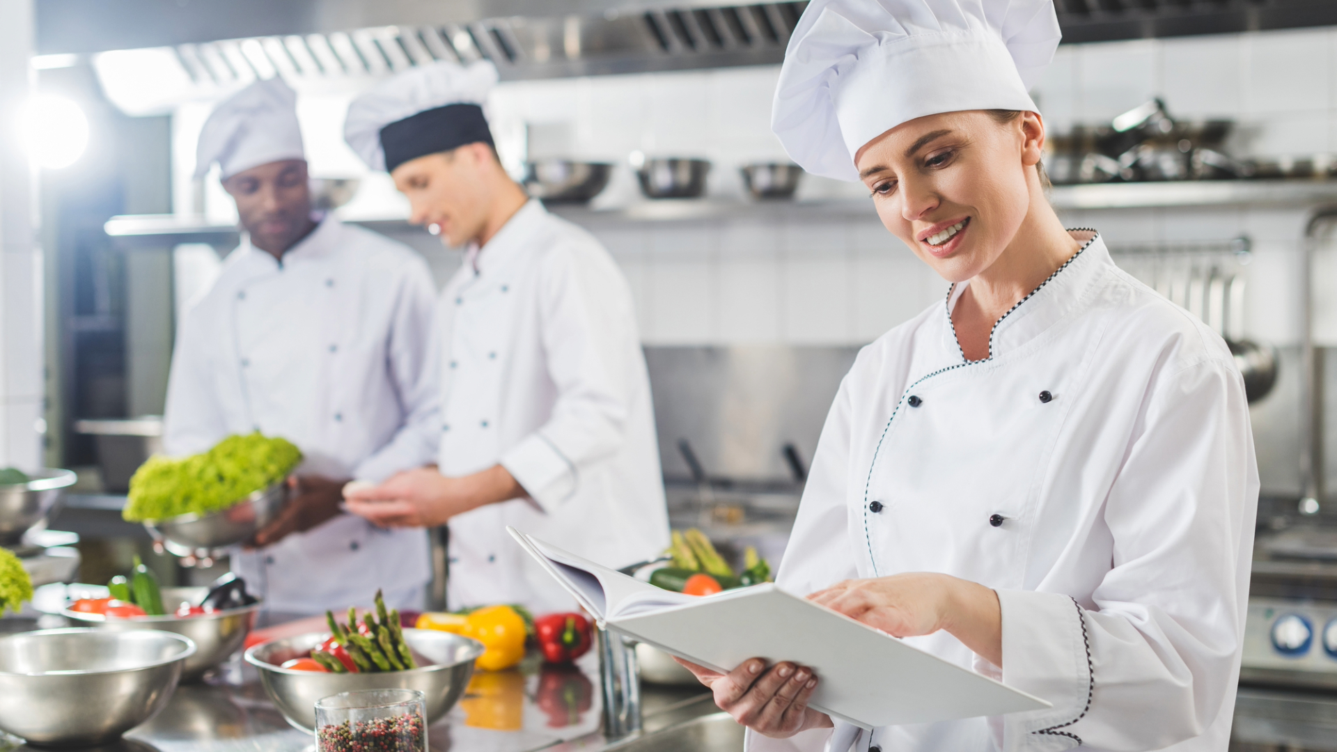 chef looking at notebook